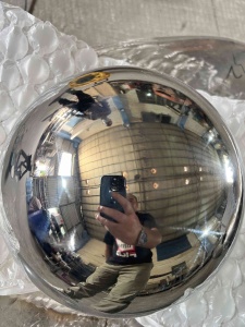 Mirror stainless steel sphere after cotton buff polishing, with a clear reflection