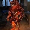 Red geometric stainless steel rhino-form sculpture with integrated LED line lighting