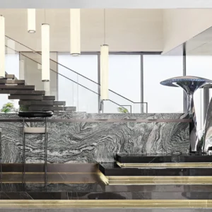 Paired mirror-finish mushroom sculptures in an interior with stone, glass and metal.
