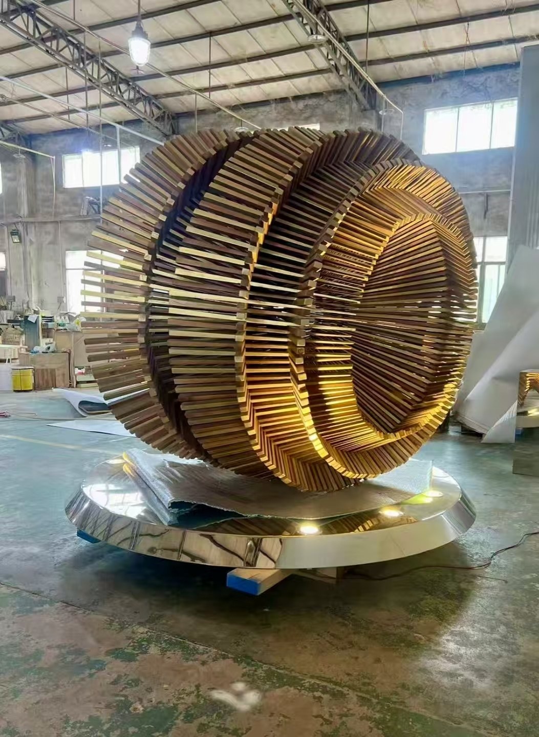 Completed layered ring sculpture from the same project during workshop inspection