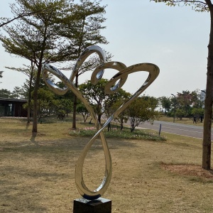 Side view of the same stainless steel spiral sculpture