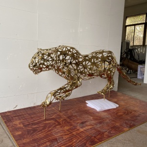 Second finished view of the same openwork leopard sculpture