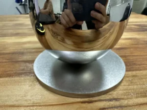 Mirror-polished stainless steel sphere on a sandblasted base